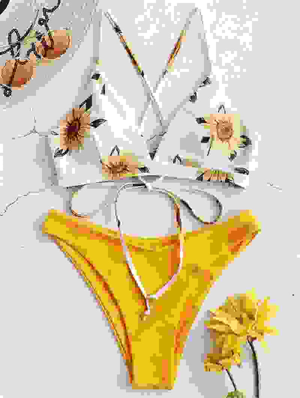 Sunflower printed bikini top with bright yellow padded biquini bottom. Sexy bandage bathing suit for trendy women's swimwear.