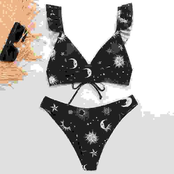Black padded biquini with celestial print, featuring sun, moon, and stars. Stylish bandage bathing suit for women’s swimwear collection.